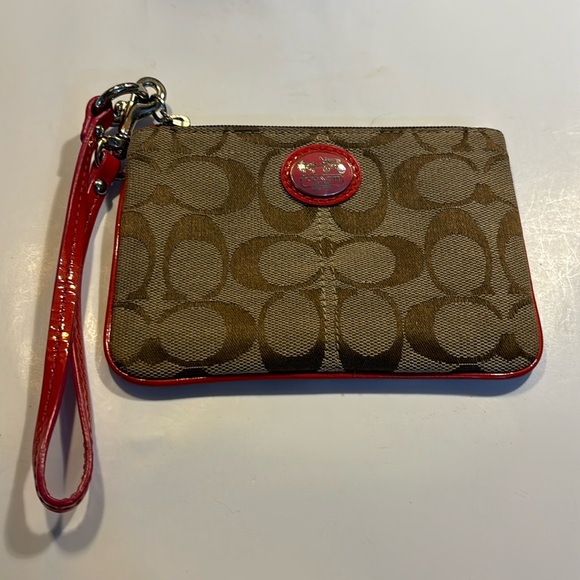 Coach Handbags - Coach small wristlet tan and dark pink also pink interior